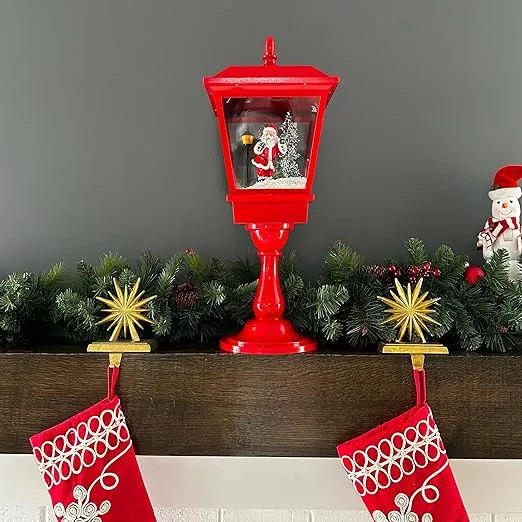 Fraser Hill Farm 25-in. Musical Snowy Christmas Lantern in Red with Santa Claus Scene, Cascading Snow, and Music, Lighted Tabletop Christmas Decoration for Living Room and Foyer